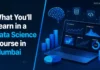 What You’ll Learn in a Data Science Course in Mumbai A student working on data visualizations and charts on a laptop in a modern classroom or co-working space